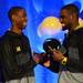 Michigan freshman Caris LeVert and junior Tim Hardaway Jr. smile as they shake hands on stage during the Michigan Alumni Association pep rally at the Renaissance Atlanta Waverly Hotel in Atlanta on Friday, April 5, 2015. Melanie Maxwell I AnnArbor.com